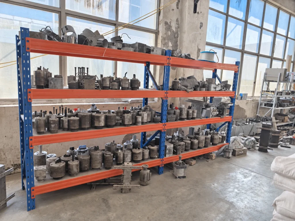 Tooling stored on racks in the workshop.